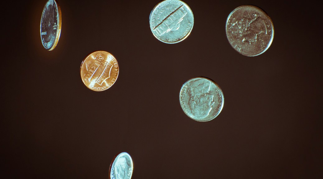 71 Cents in free fall with a black background